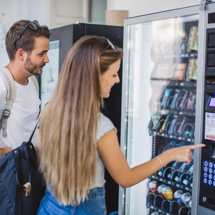 couple using vending machine