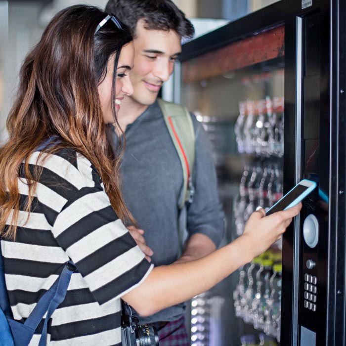 couple using vending machine